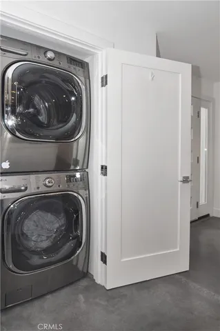 a utility room with washing machine