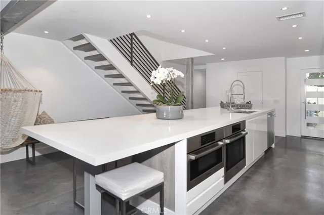 a kitchen with a sink and cabinets