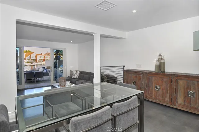 a kitchen with kitchen island a sink and wooden floor