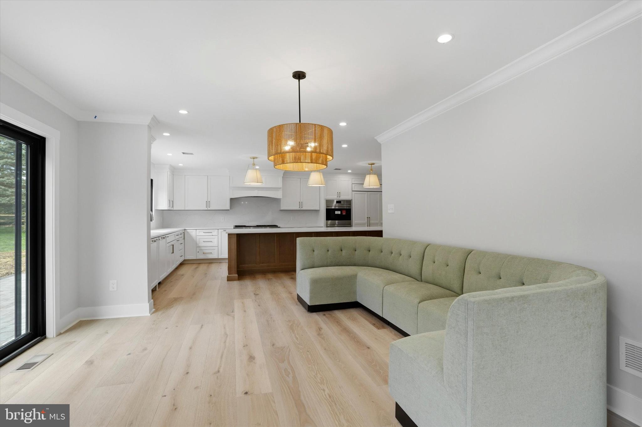 292 Church Road Devon, PA 19333 - Photo 12 of 49 a living room with kitchen island furniture and a chandelier