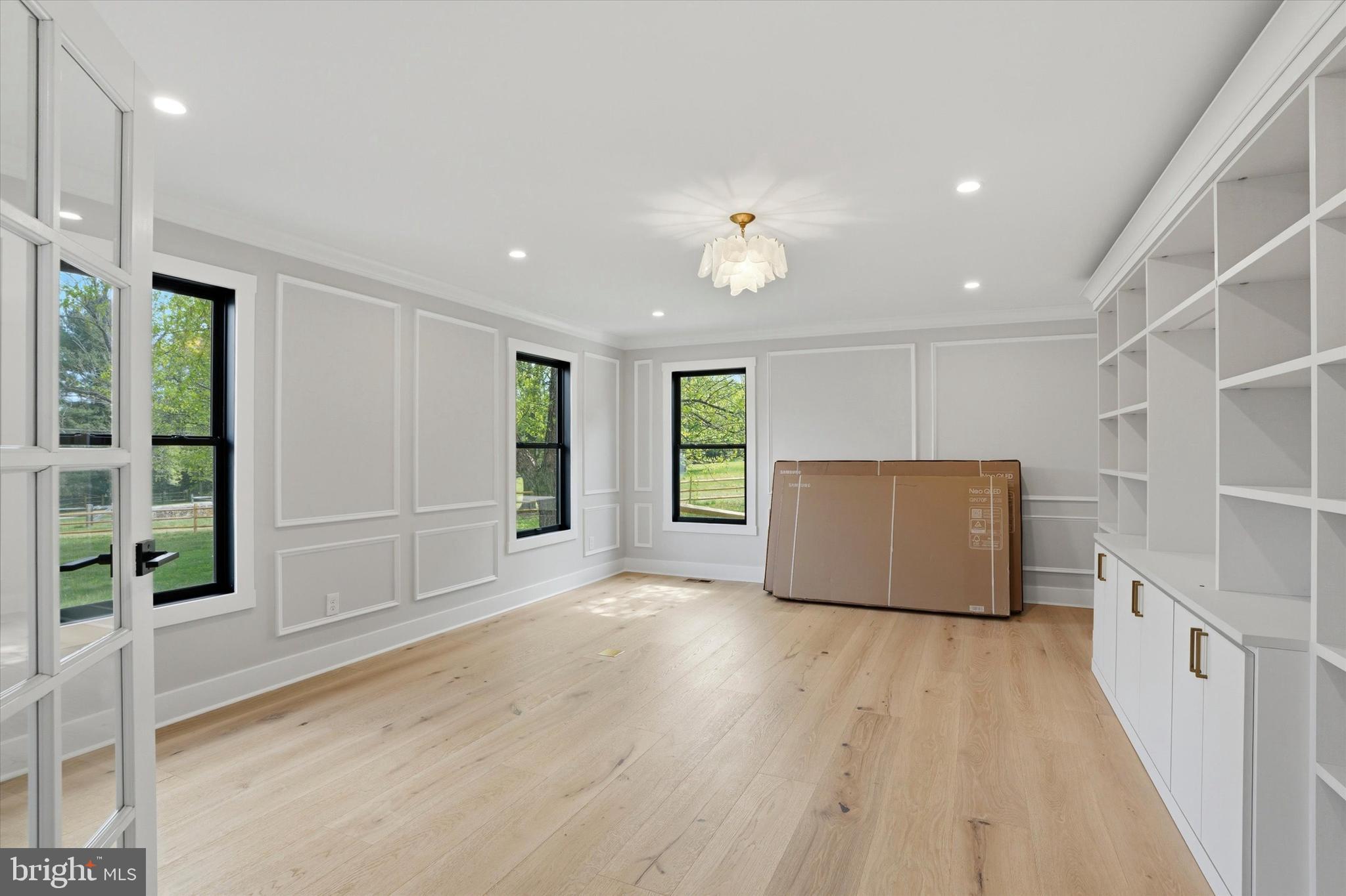 292 Church Road Devon, PA 19333 - Photo 15 of 49 a view of an empty room with a window and wooden floor