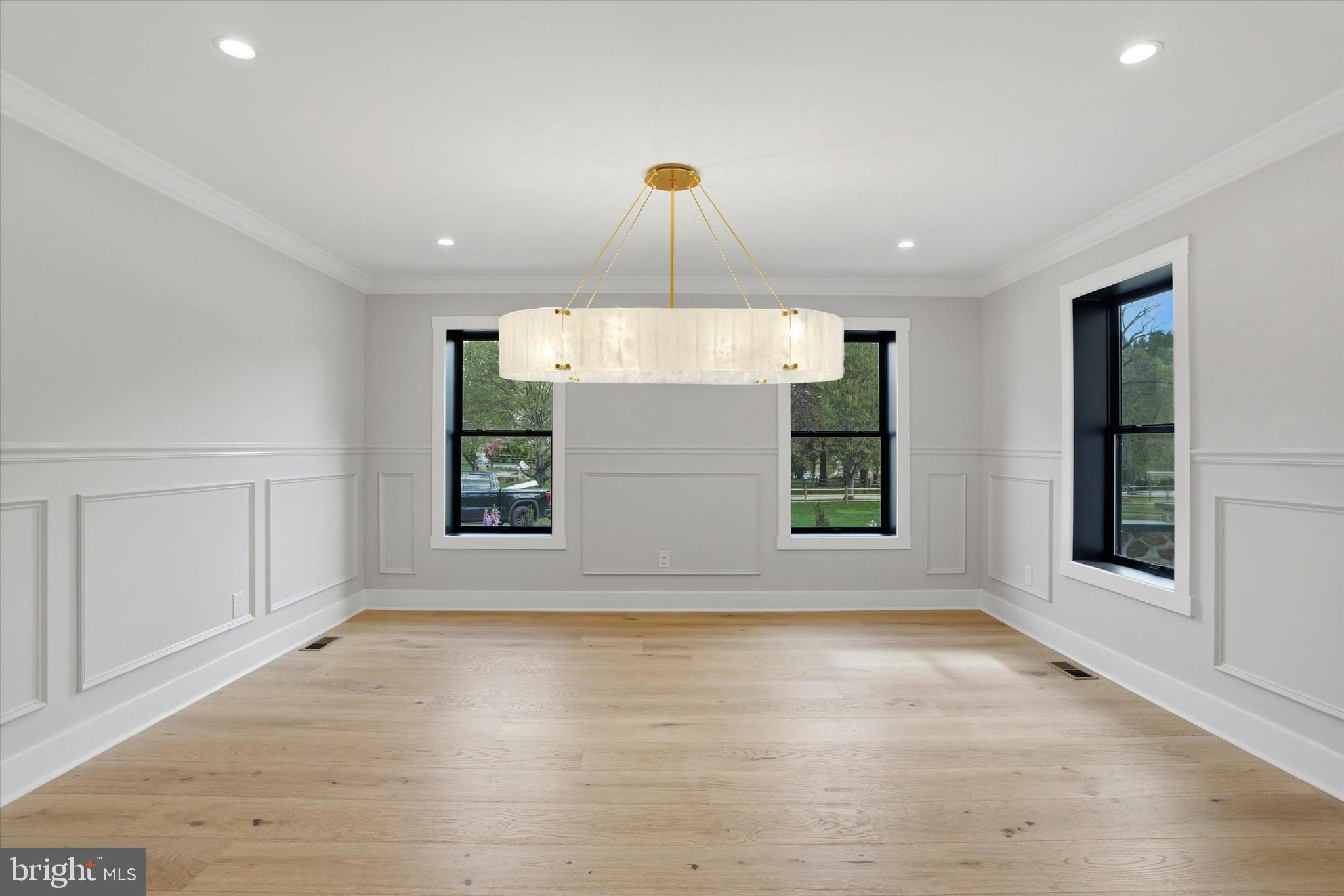 292 Church Road Devon, PA 19333 - Photo 18 of 49 an empty room with windows and chandelier