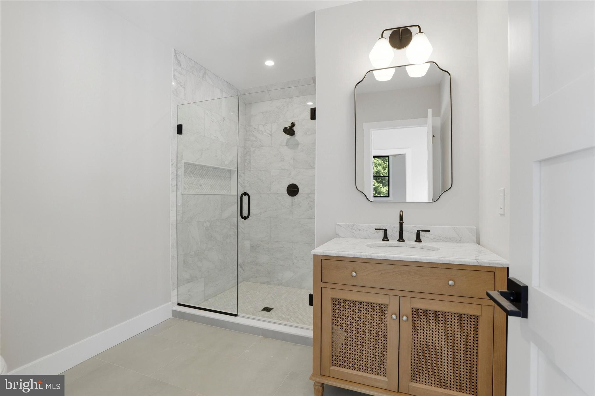 292 Church Road Devon, PA 19333 - Photo 25 of 49 a bathroom with a sink a toilet and shower