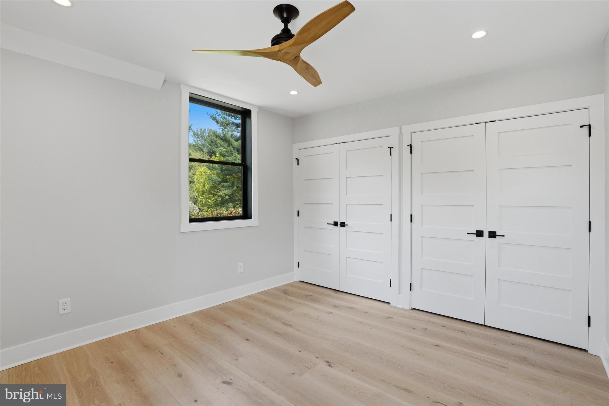 292 Church Road Devon, PA 19333 - Photo 26 of 49 wooden floor in an empty room with a window
