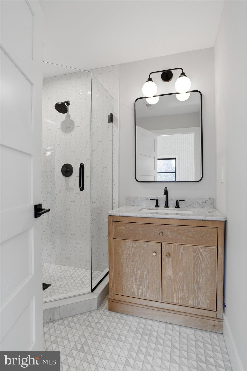 292 Church Road Devon, PA 19333 - Photo 44 of 49 a bathroom with a sink mirror and shower