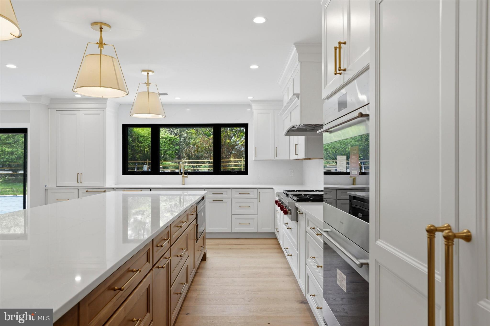 292 Church Road Devon, PA 19333 - Photo 6 of 49 a kitchen with stainless steel appliances a stove and a sink