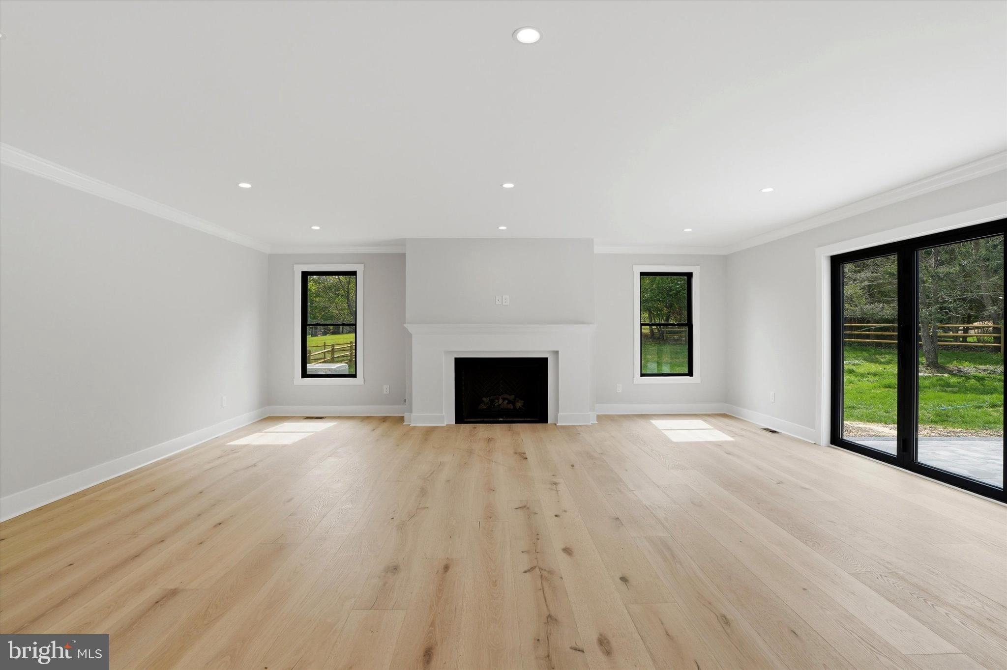292 Church Road Devon, PA 19333 - Photo 9 of 49 an empty room with windows and fireplace