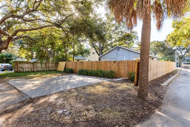 a backyard of a house with lots of green space