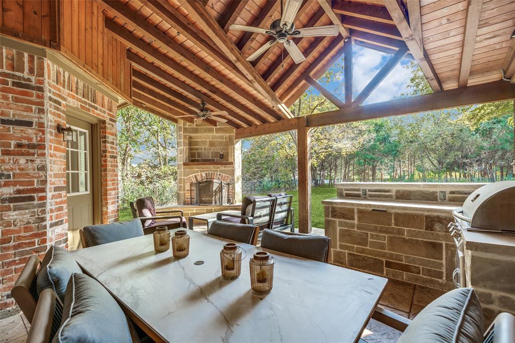 1110 Hart Road Fairview, TX 75069 - Photo 12 of 13 a view of a dining room with furniture large windows and wooden floor