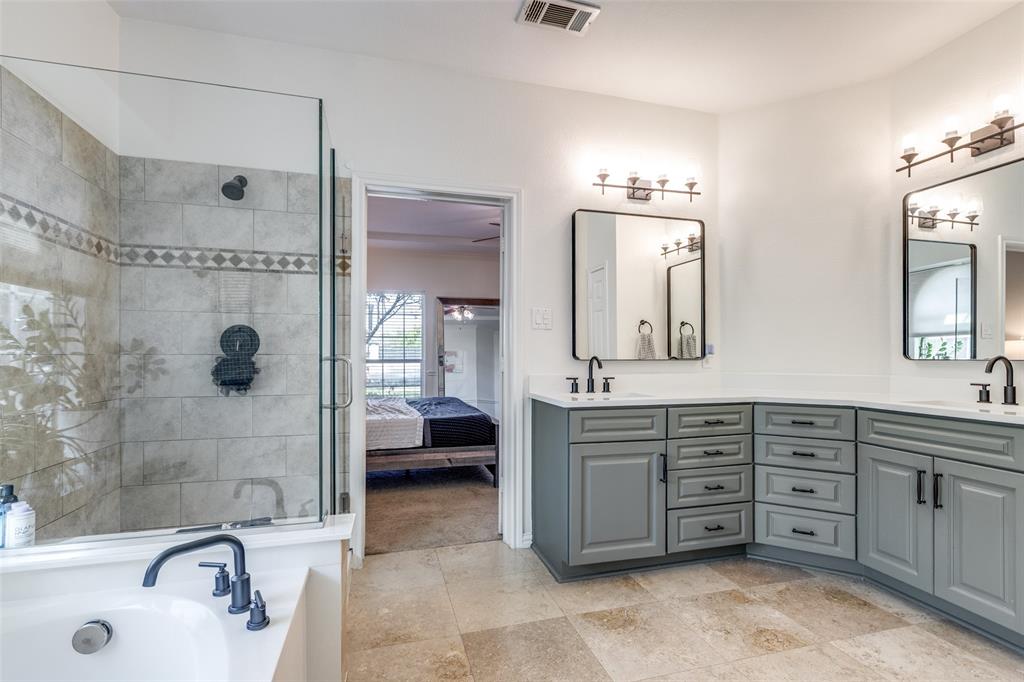 1110 Hart Road Fairview, TX 75069 - Photo 7 of 13 a bathroom with a tub sink and mirror
