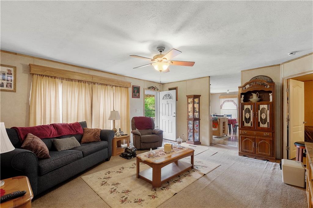 534 Finks Run Road McDonald, PA 15057 - Photo 18 of 35 a living room with furniture a ceiling fan and a window
