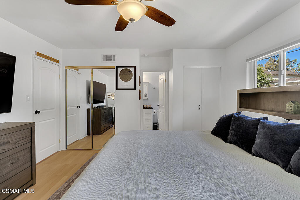 2224 Alscot Avenue Simi Valley, CA 93063 - Photo 12 of 34 a bedroom with a bed and a chandelier