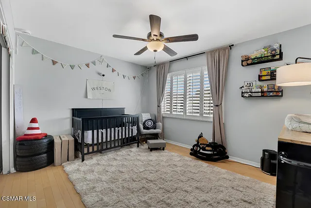 a bedroom with furniture and a bed