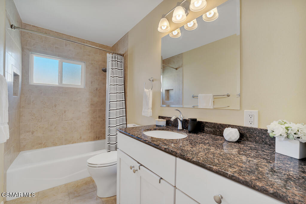 2224 Alscot Avenue Simi Valley, CA 93063 - Photo 17 of 34 a bathroom with a granite countertop sink a toilet and bathtub