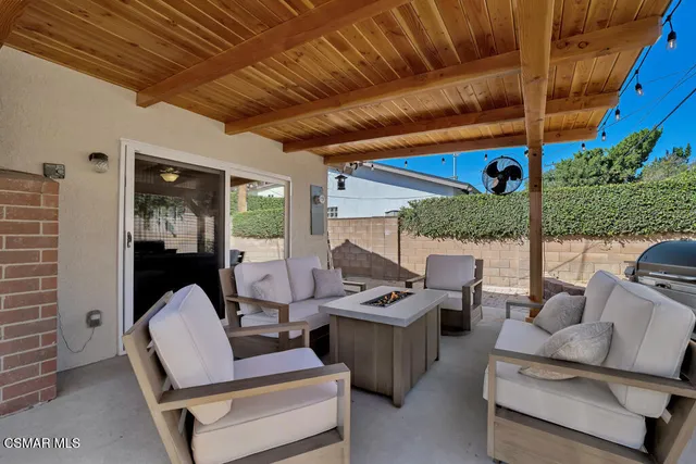 a outdoor living space with patio furniture and garden view