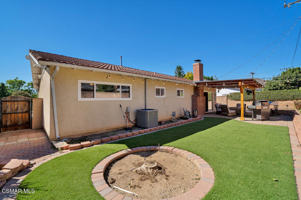 2224 Alscot Avenue Simi Valley, CA 93063 - Photo 22 of 34 a view of a house with backyard sitting area and swimming pool