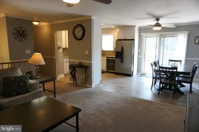 a kitchen with a sink cabinets stainless steel appliances and a window
