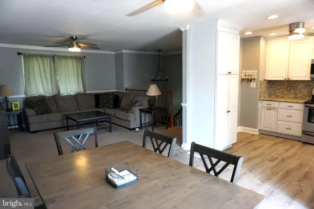 a spacious bedroom with a bed and a flat screen tv