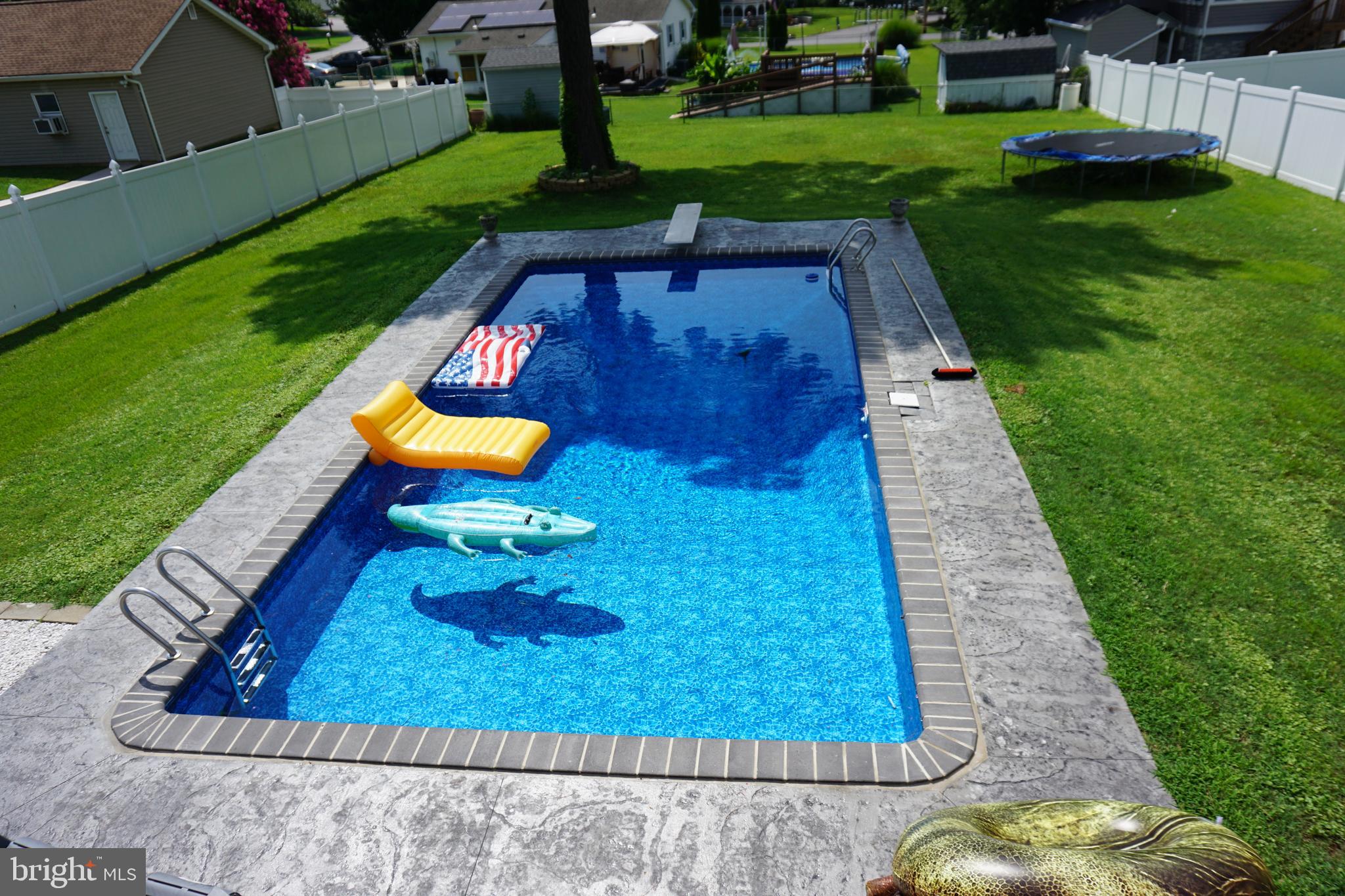 8610 Oak Road Sparrows Point, MD 21219 - Photo 2 of 59 a view of a backyard with swimming pool