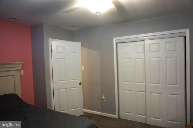 a living room with a fireplace and a flat screen tv