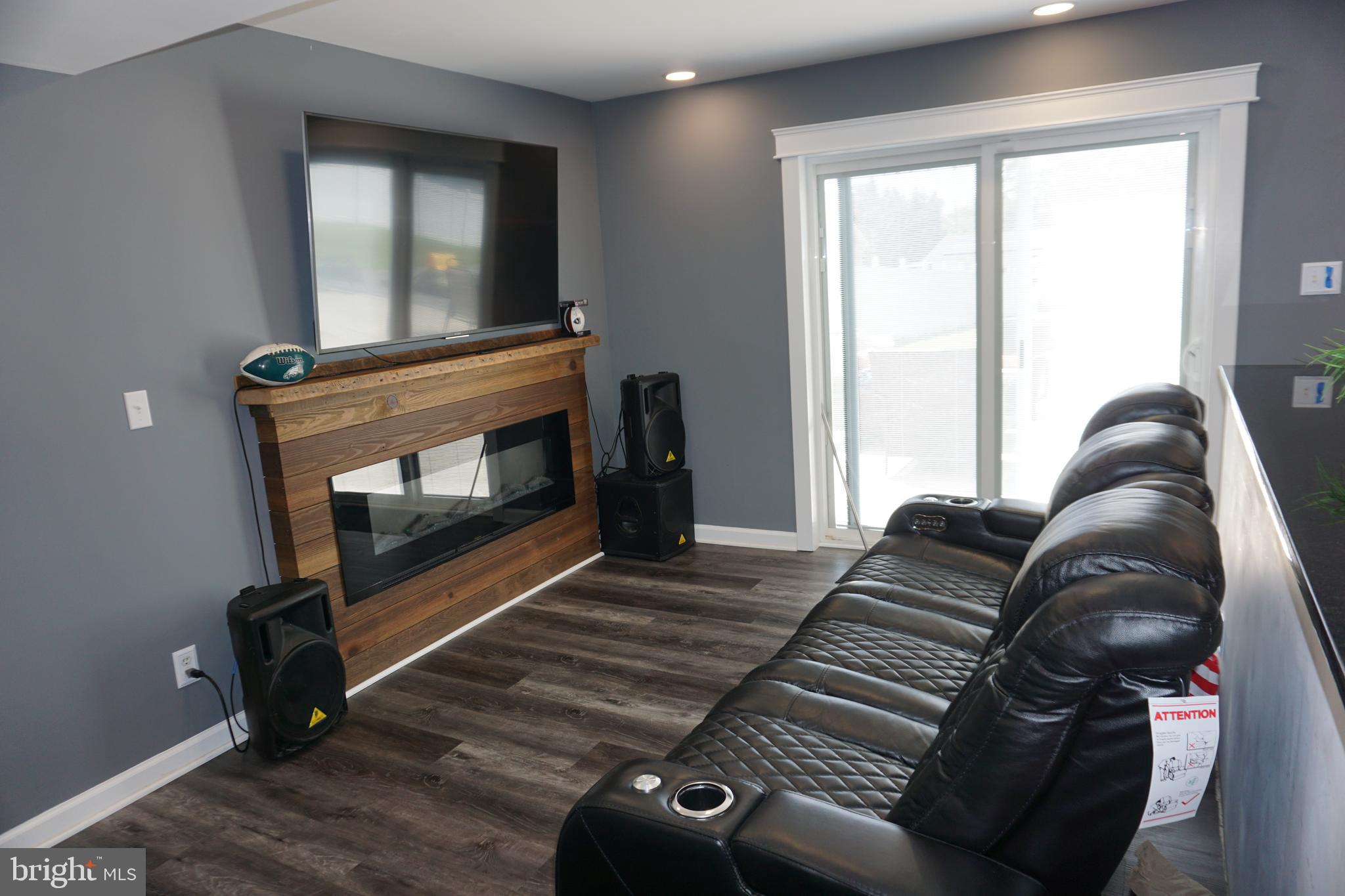 8610 Oak Road Sparrows Point, MD 21219 - Photo 3 of 59 a living room with furniture and a fireplace