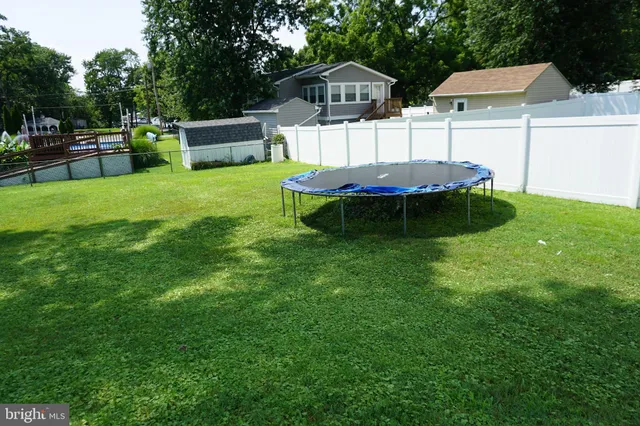 a view of a house with a yard porch and sitting area