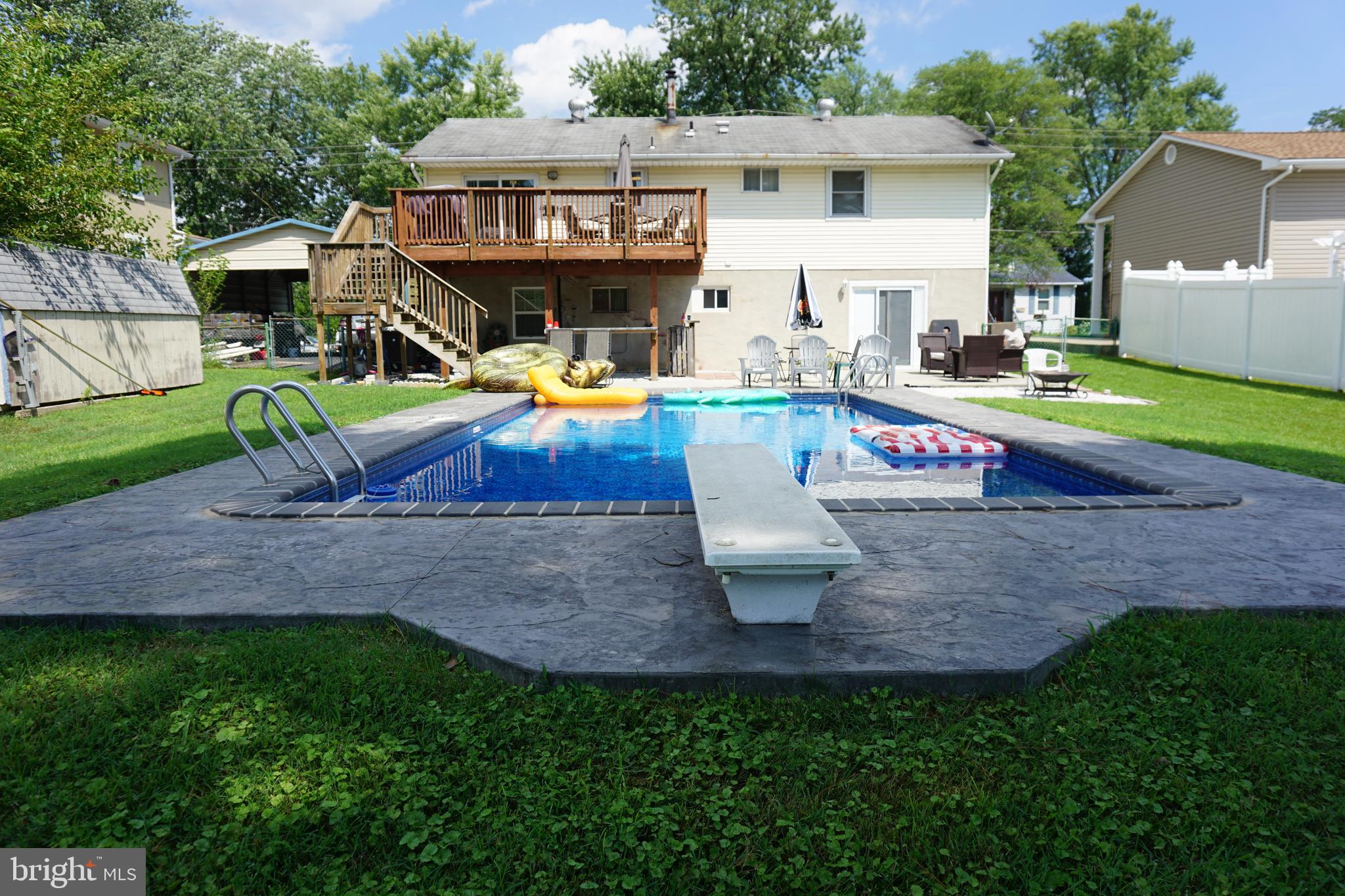 8610 Oak Road Sparrows Point, MD 21219 - Photo 37 of 59 a view of a house with backyard sitting area and swimming pool