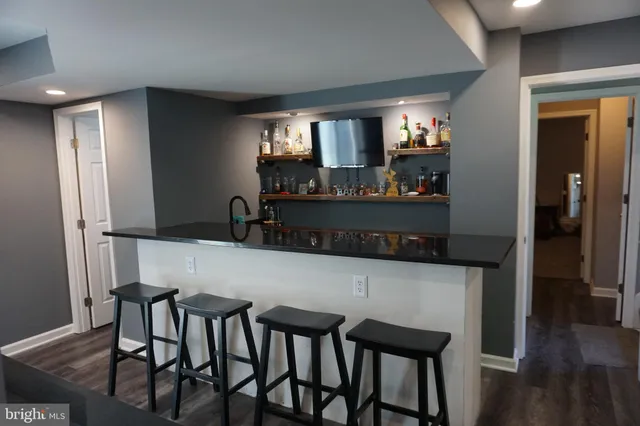 a bathroom with a toilet and a shower curtain