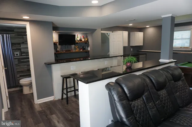 a view of a dinning tables and chairs in the balcony