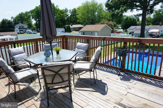 a view of a chairs and table on the deck