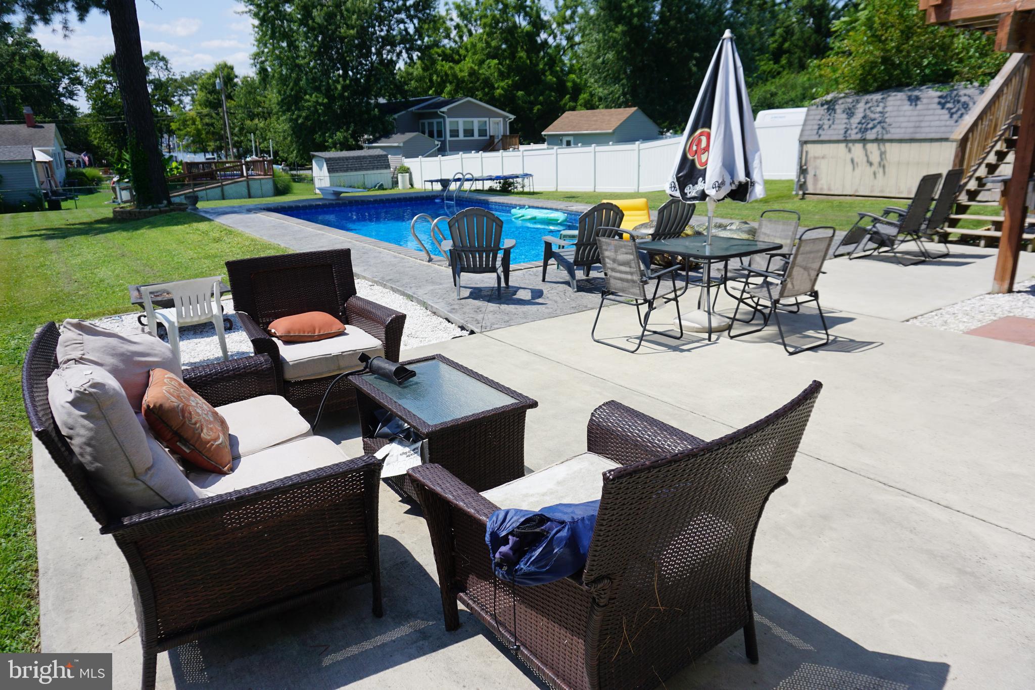 8610 Oak Road Sparrows Point, MD 21219 - Photo 6 of 59 a outdoor space with patio the couches and pool