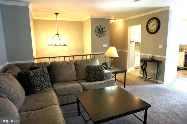a living room with couches and a table