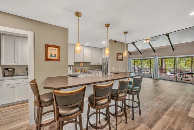 a dining room with furniture and window