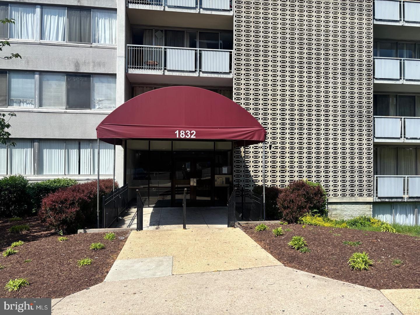 1832 Metzerott Road, Unit 306 Hyattsville, MD 20783 - Photo 2 of 2 a front view of a building with garden