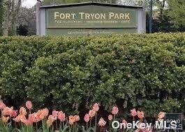 225 Bennett Avenue, Unit 1N Manhattan, NY 10040 - Photo 3 of 11 a sign that is sitting in front of flowers