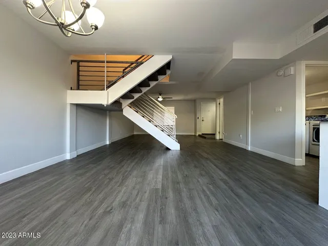 a view of an entryway with wooden floor