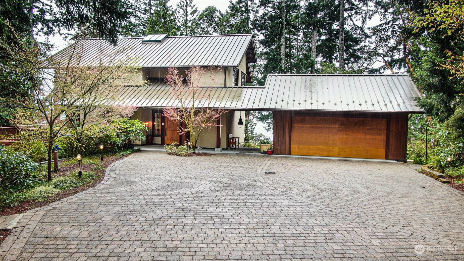 13629 Burma Road Southwest Vashon, WA 98070 - Photo 1 of 39 a front view of a house with garage