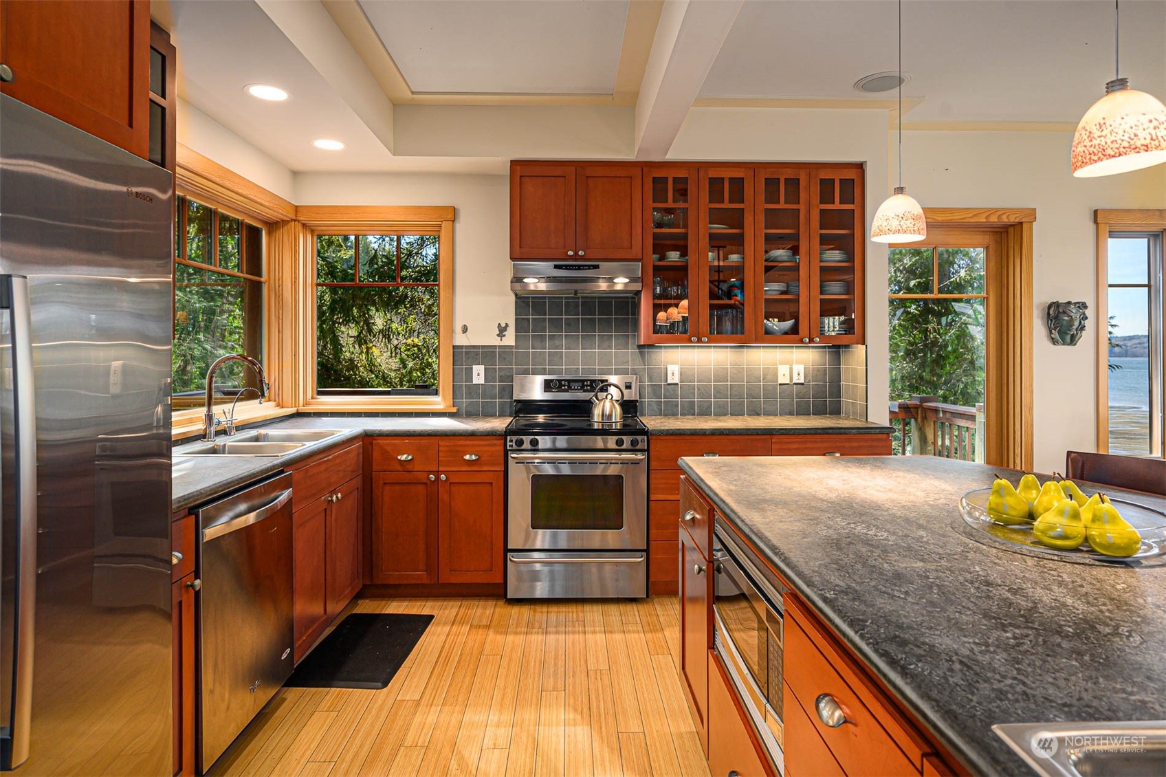 13629 Burma Road Southwest Vashon, WA 98070 - Photo 11 of 39 a kitchen with stainless steel appliances granite countertop a stove and a sink
