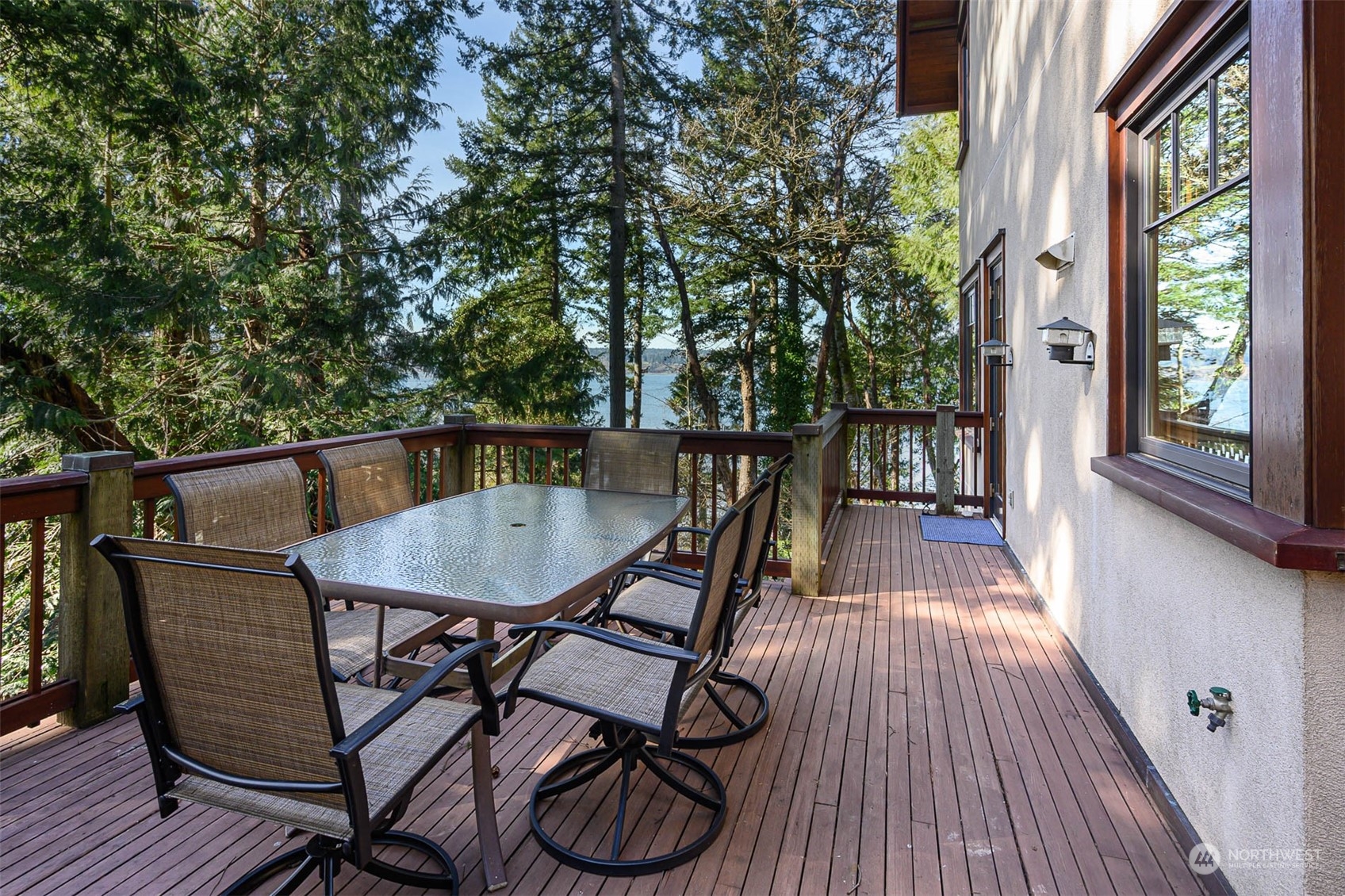 13629 Burma Road Southwest Vashon, WA 98070 - Photo 12 of 39 a balcony with wooden floor table and chairs