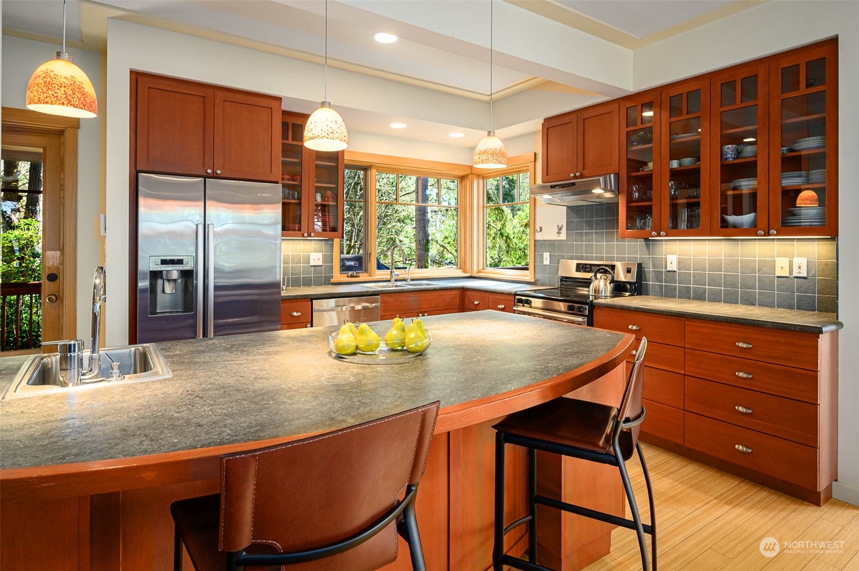 13629 Burma Road Southwest Vashon, WA 98070 - Photo 10 of 39 a kitchen with a table chairs and cabinets