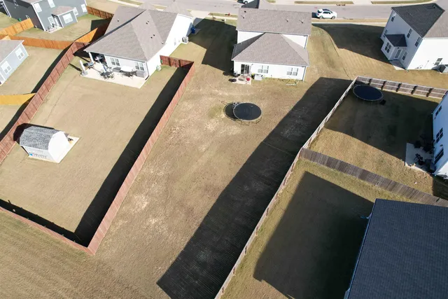 a view of residential houses with yard