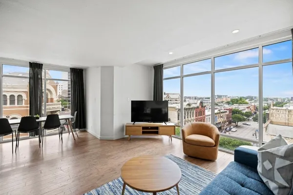 a living room with furniture and a flat screen tv
