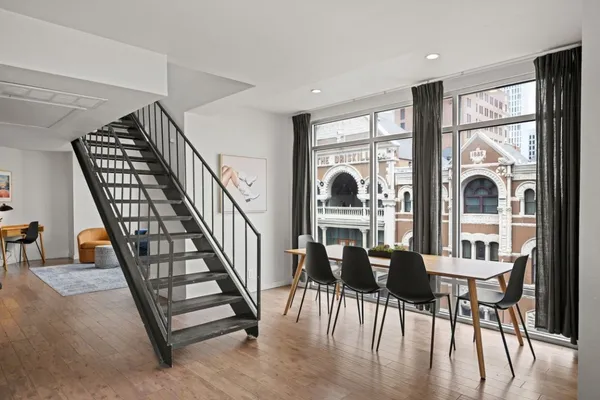 a view of a dining room with furniture window and wooden floor
