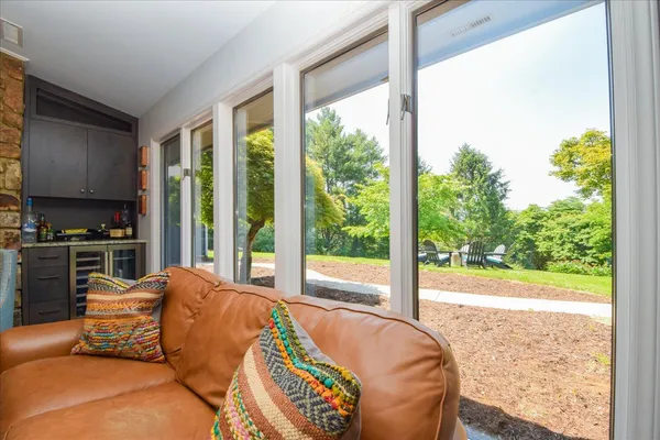 a bedroom with a bed dresser and a window