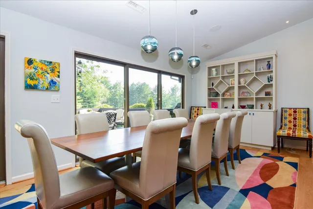 a bedroom with a bed and a table