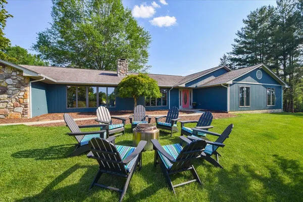 an aerial view of a house with swimming pool garden and patio