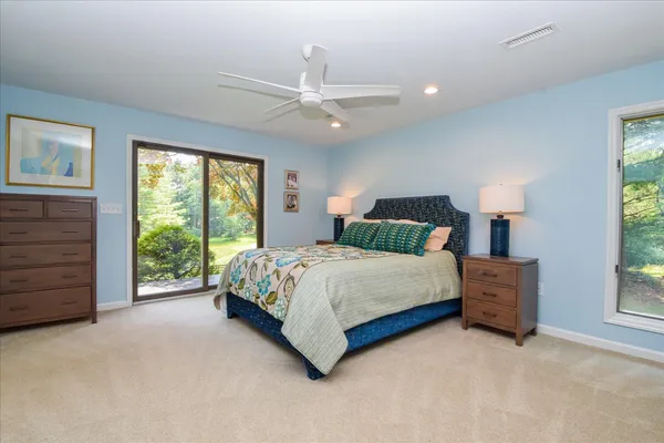 a bedroom with a bed and a table