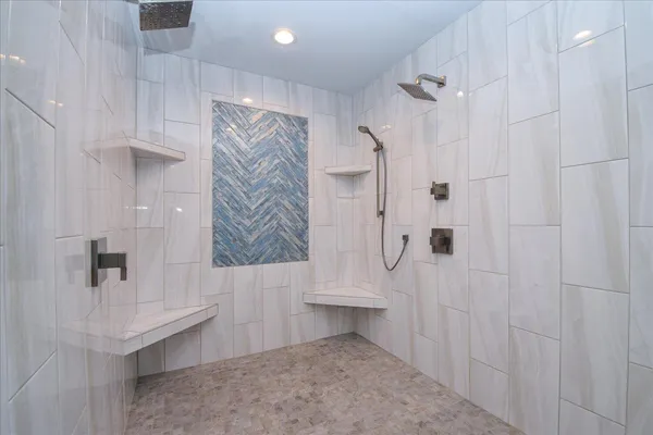 a green field with lots of trees in it