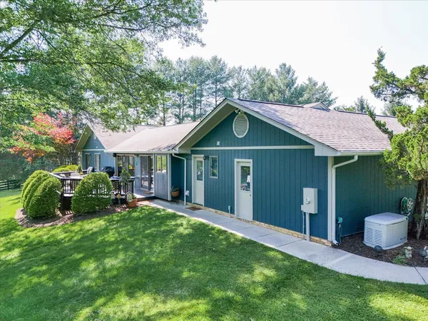 a living room with furniture fireplace and flat screen tv
