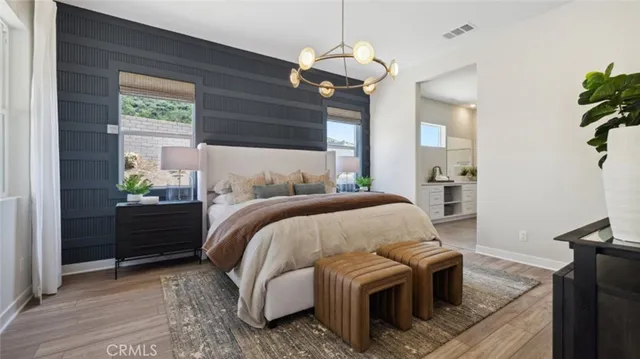 a bedroom with bed and window